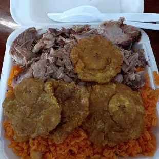 Pernil and tostones. The tostones were absolutely delicious! The pernil was really tasty too.