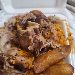 a close up of a meal in a styrofoam container