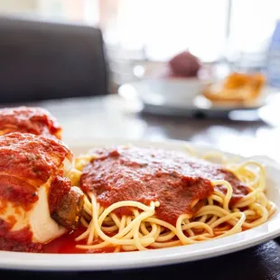 a plate of spaghetti and meat