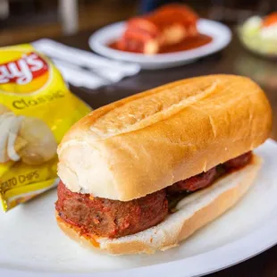 a meatball sandwich and chips