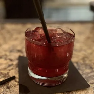 a drink in a glass with a straw