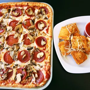 a slice of pizza with pepperoni and mushrooms