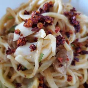 Hot chili flakes on the noodle salad