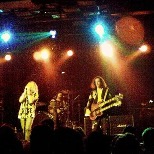 ows the band performing on stage