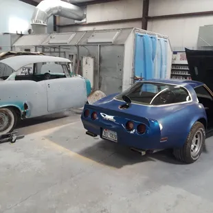 82 Corvette being repaired and painted, 1956 hardtop in the background going in to Restoration