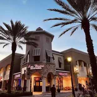 a person walking in front of a restaurant