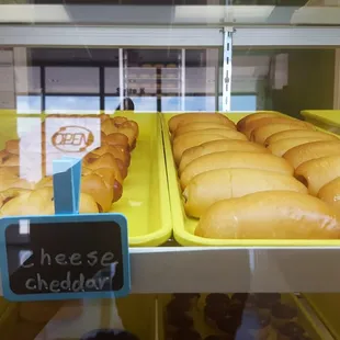 a variety of pastries in a display case