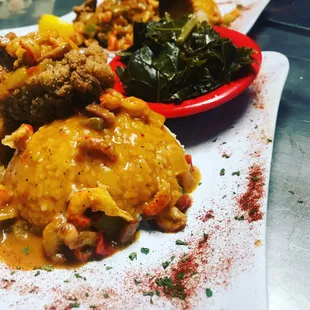 Fried Red Snapper Creole Crawfish Gratin Sauce and a side of Green's