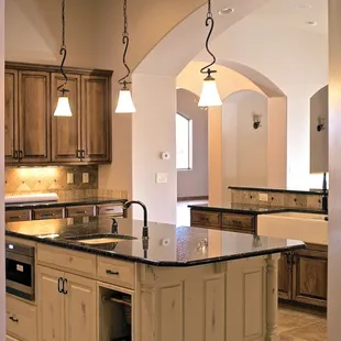 a large kitchen with a center island