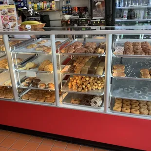 a display case filled with donuts