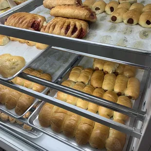 a display case filled with pastries
