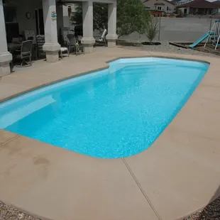 New Pool Install, Viking fiberglass pool, colored concrete broom finish