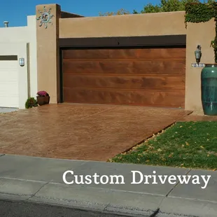 Stamped, highlighted and sealed concrete driveway.