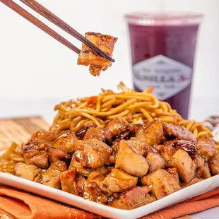 a plate of food with chopsticks