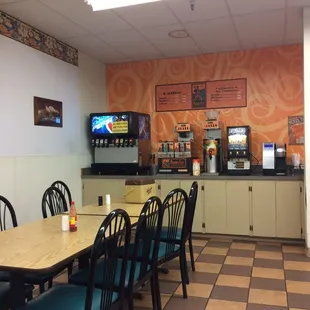 South corner of grocery corner - a dining nook with self serve pop, cappuccino, K-cup machine, tea, microwave, etc