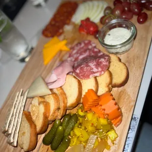 a platter of meat and cheeses