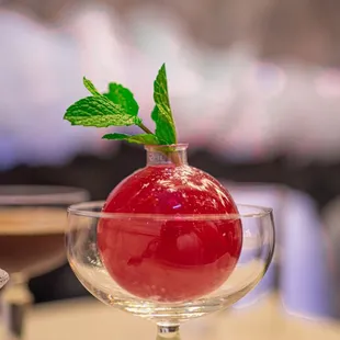 an apple in a wine glass