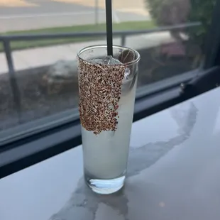 a glass of water with a sprinkle of sprinkles