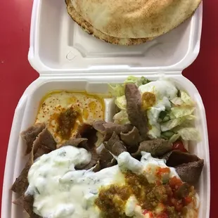 Gyro platter: gyro, hummus, salad, and rice topped with our signature home made gyro sauce. Comes with 2 pitas.