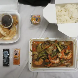 Szechuan shrimp ($11.99) with white rice and 6 pan-fried pork dumplings ($5.99)