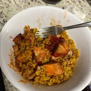 a bowl of rice and meat