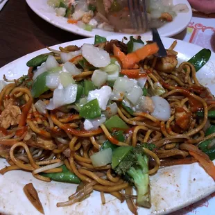 a plate of noodles and vegetables