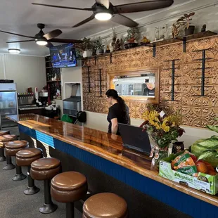 a woman standing at the counter