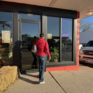 a woman entering the store