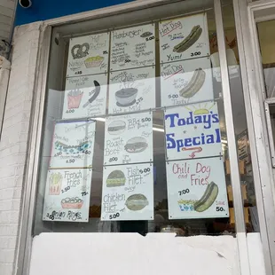 a storefront window with a variety of items