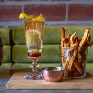 a glass of wine and french fries