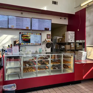 a counter with a variety of donuts