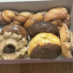 Maple old fashion, custard-filled with chocolate frosting, chocolate cake, blueberry cake, cinnamon braid