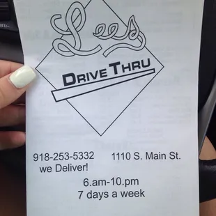 a hand holding a piece of paper