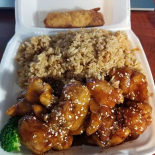 Sesame Chicken with fried rice and egg roll.