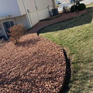 a mulch bed in front of a building