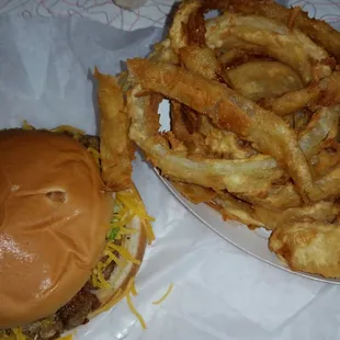a hamburger and onion rings