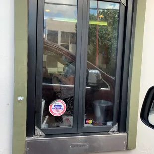 the reflection of a car in the window