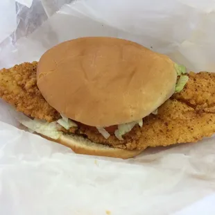 Catfish sandwich dressed from drive thru.