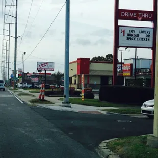 View driving down airline, has a drive-thru.