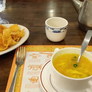 Tea, chips with sauce and egg drop soup.
