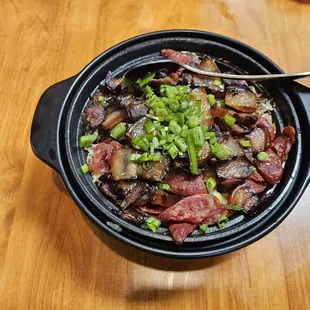 Stone pot rice with Chinese sausage and Chinese bacon.