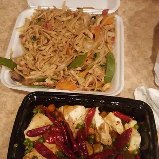 two take out containers of food