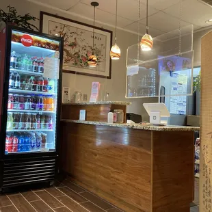 the front desk and refrigerator