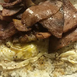 Eggs, bacon crispy, and luncheon meat.