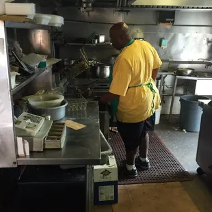 a man preparing food in a kitchen