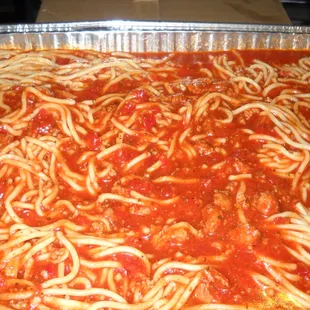 a pan of spaghetti and meat