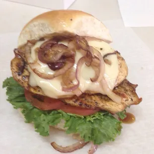 Grilled chicken sandwich with grilled onions and Swiss