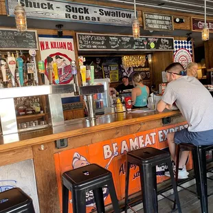 a man sitting at the bar