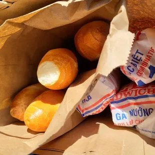 a brown paper bag filled with oranges