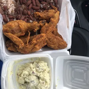 Red beans with fried chicken and potato salad  Mind you the chicken is legs which is portrayed as white meat wings